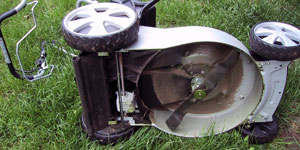 gas lawn mower blade override